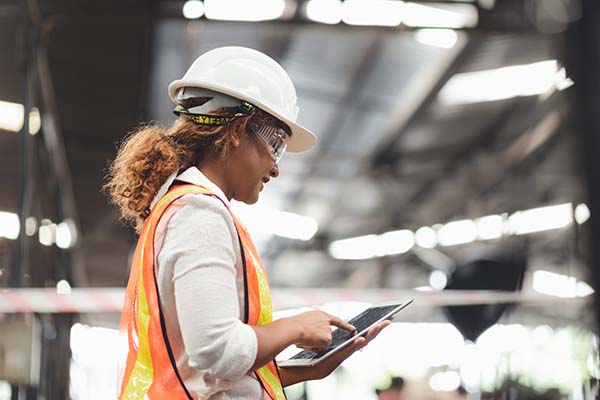 ABB Ability Life Cycle Assessment images shows a lady monitoring the performance of a drive on a tablet