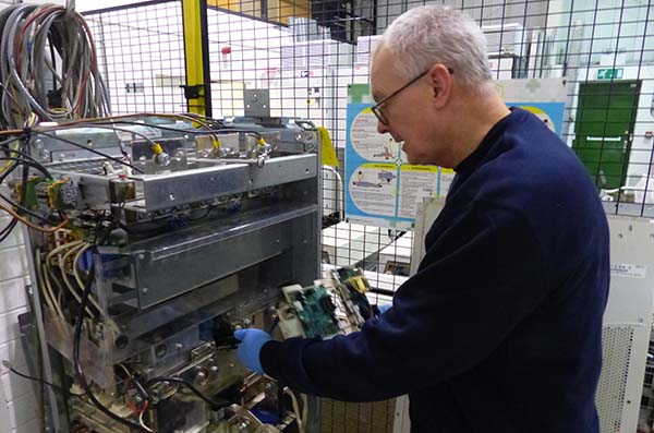 inverter service contract picture shows an uds engineer servicing a variable speed drive