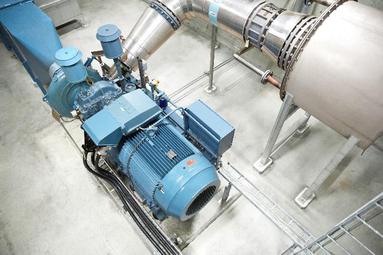 Industrial water industry pump and motor installation with stainless steel pipework, optimised using variable speed drive control.